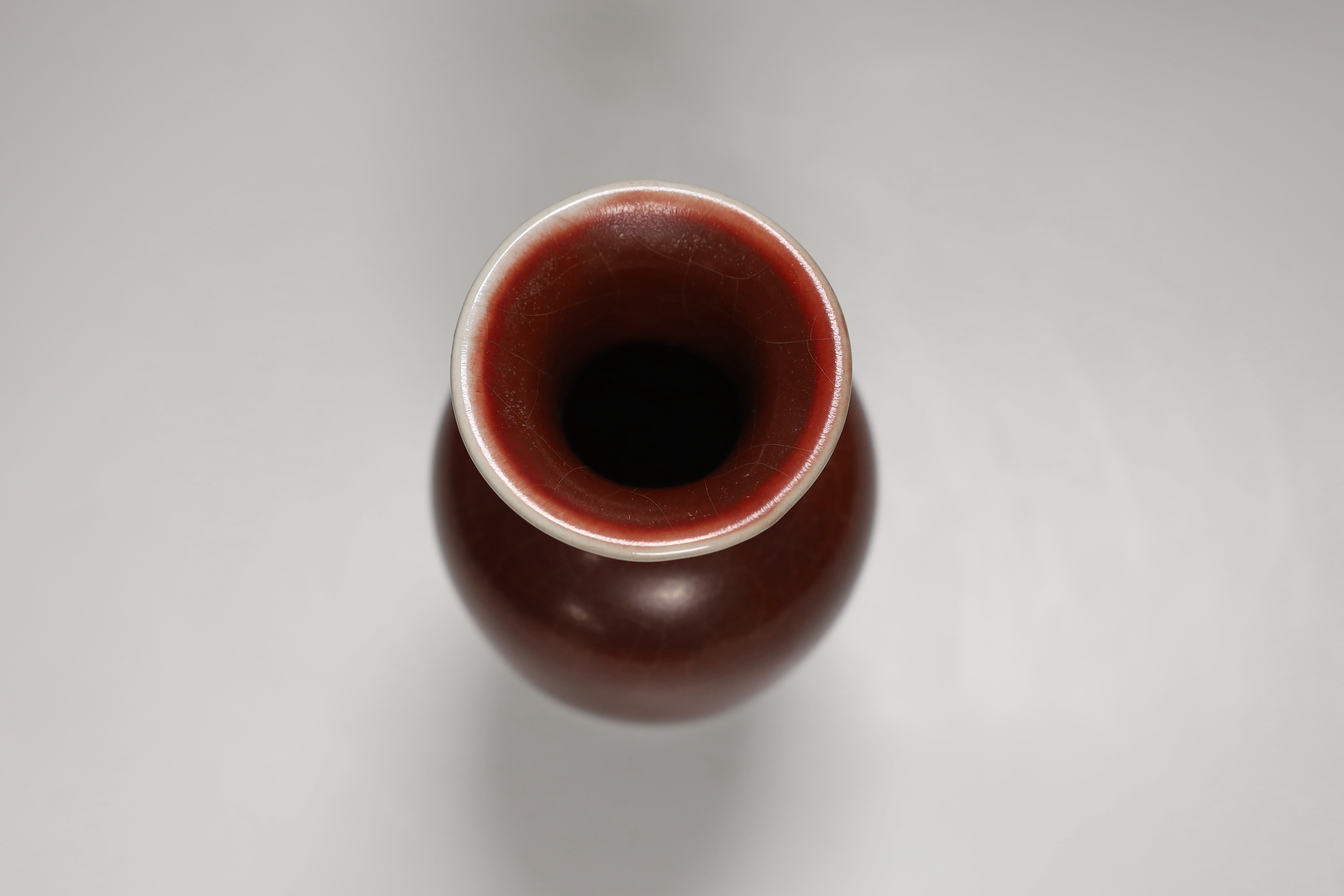 A Chinese sang de boeuf baluster vase, 18.5cm